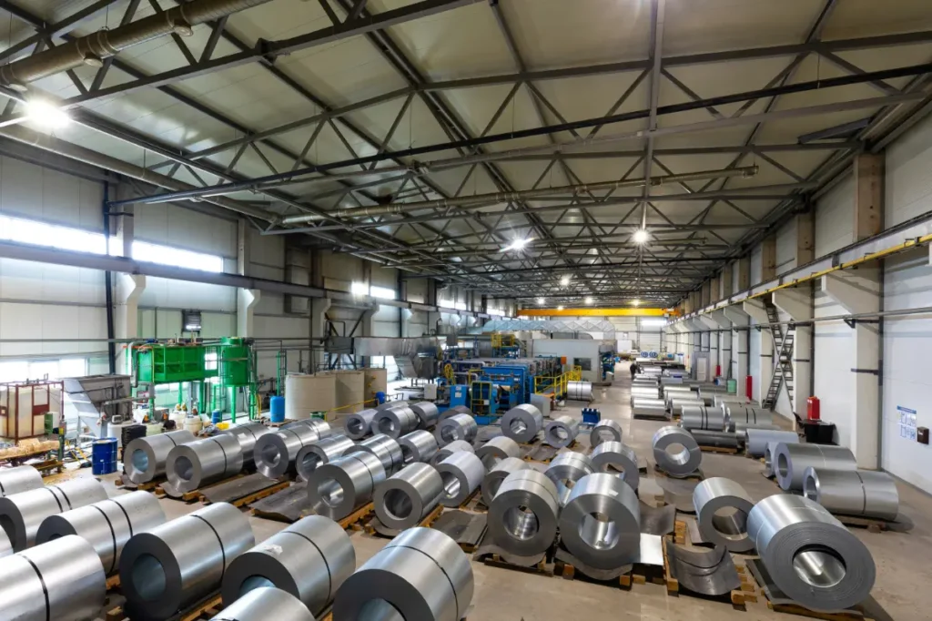 A warehouse filled with rolls of aluminum
