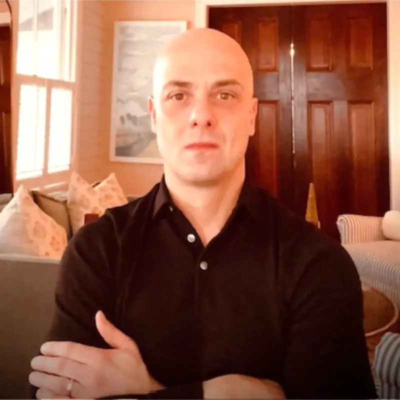 Headshot of Cris Tantillo, the founder of Corridor Industries. Black polo, arms crossed.